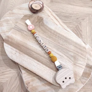 Attache tétine fantaisie jaune moutarde avec marguerite