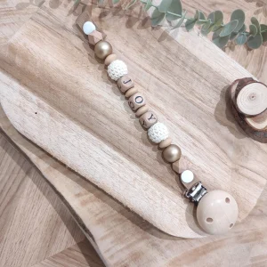 Attache tétine doré