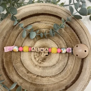 Attache tétine jaune et rose framboise