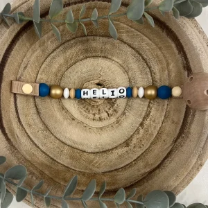 Attache tétine or et bleu canard