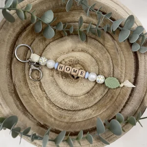 Porte-clé blanc nacré et feuille vert sage