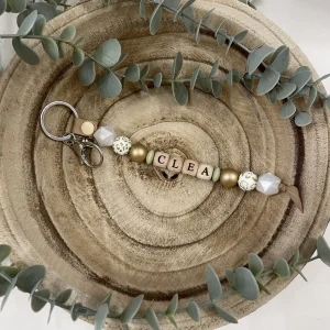 Porte-clé or et blanc nacré