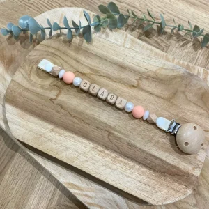 Attache tétine pêche blanc nacré